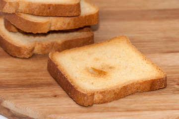 Crunchy toast bread on the wooden board