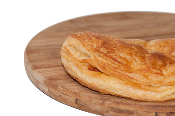 Pizza pastry half on the wooden board
