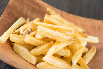 french fries on wood background