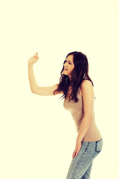 Young woman hits someone.