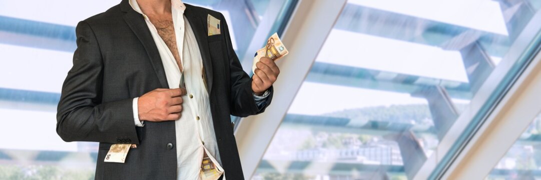 Disheveled Businessman In A Black Suit And Money In Pockets