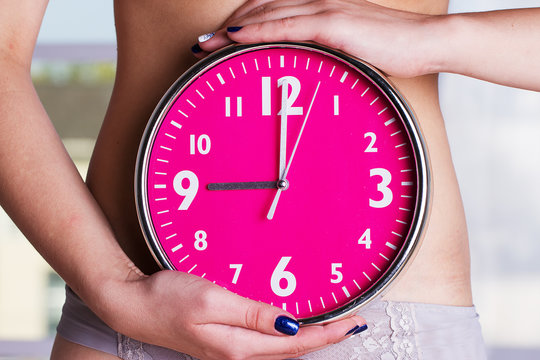 Biological clock ticking - Pink watches in female hands