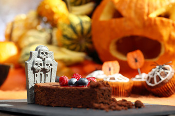 Chocolate cake with fruit in shaped coffin on Halloween day