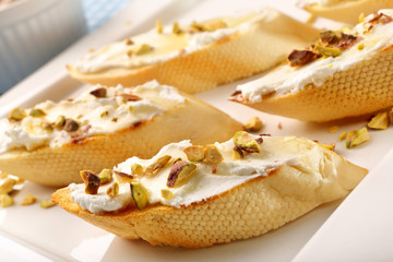 Bruschetta sandwich with goat cheese honey and pistachios