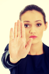 Business woman making stop sign.