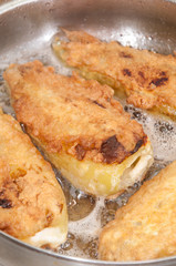Frying paprika stuffed with cheese