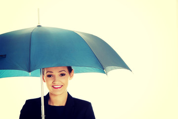 Business woman is holding blue umbrella. 