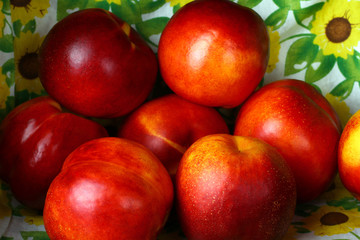 peaches on the background of flowers closeup