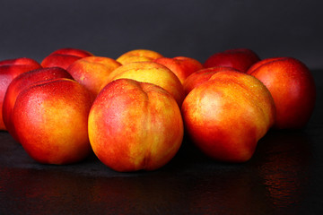 Fototapeta na wymiar peaches on a black background