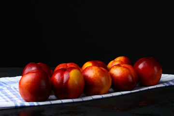peaches on a napkin isolated on black background