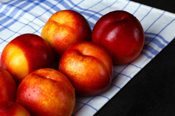 peaches on a napkin isolated on black background