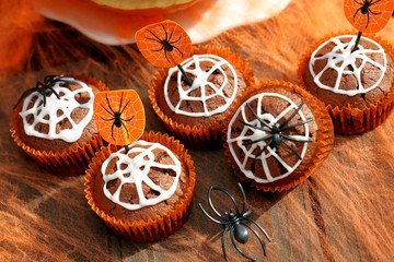 Chocolate muffin cake with spider web on Halloween day