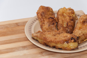 Fried paprika stuffed with cheese and served