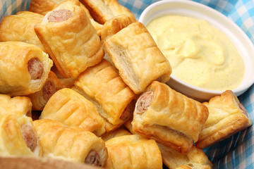 German frankfurter sausages in puff pastry with mustard sauce