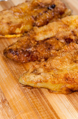 Fried stuffed paprika with cheese on the wooden board