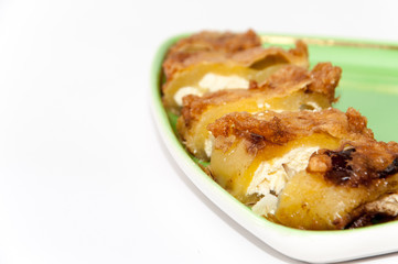 Sliced and served stuffed paprika with cheese