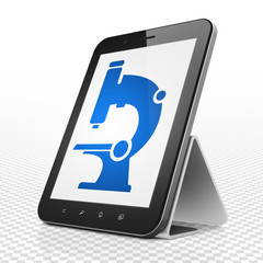 Science concept: Tablet Computer with Microscope on display