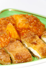Sliced and served stuffed paprika with cheese