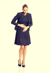 Businesswoman with strong stomachache