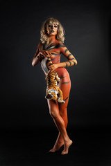 Fototapeta na wymiar Young Woman In Tiger's Body Art