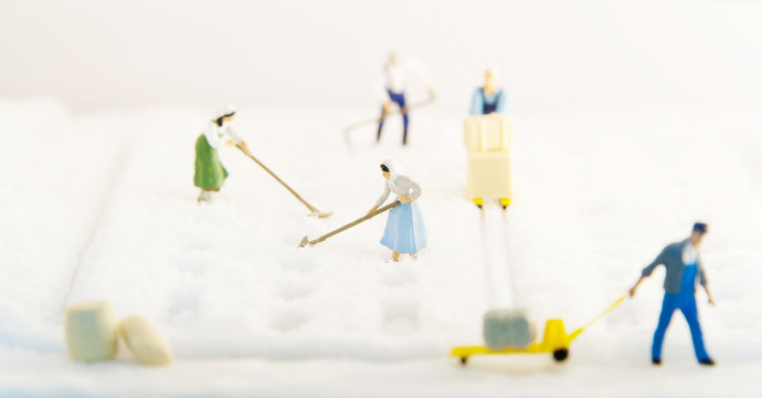 Miniature people harvesting Salt.