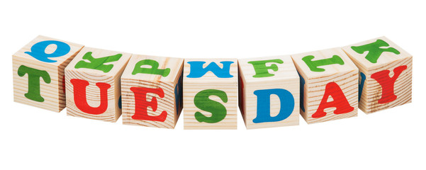 Wooden cubes. Days of the week. Tuesday word isolated on a white background