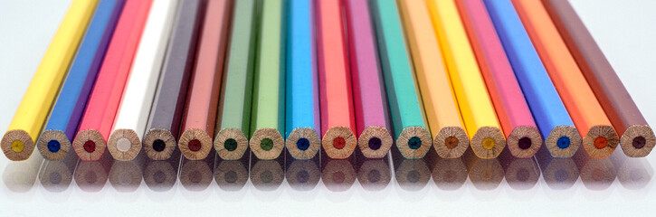 The colored pencils on a white background