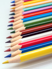 The colored pencils on a white background