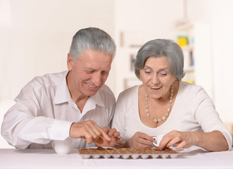 Old couple with chocolate candies