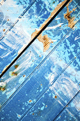 nail stripped   in the blue wood door  rusty