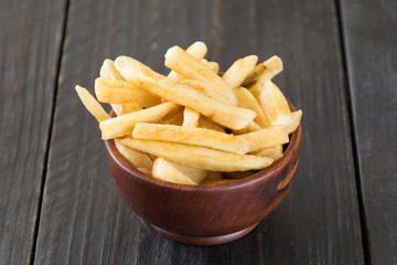 french fries on wood background