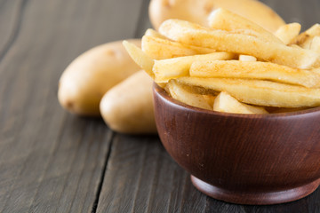 french fries on wood background