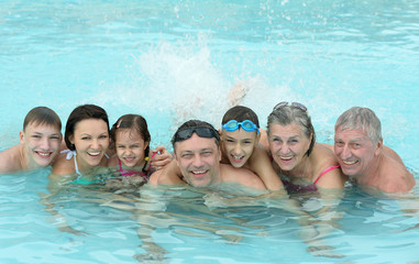Family relax in  pool