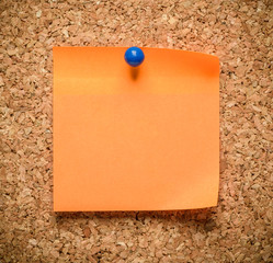 pure orange sticker on cork background