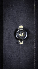 Naklejka premium The fabric background with button clous-up