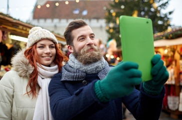 couple taking selfie with tablet pc in old town - Powered by Adobe