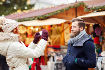 couple taking selfie with smartphone in old town