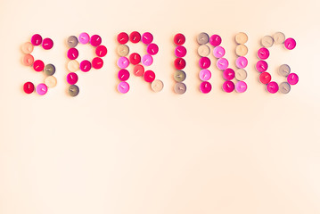 Tea Candles Arranged to Word Spring