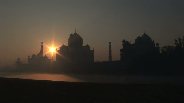 Static shot of sunrise over Taj Mahal