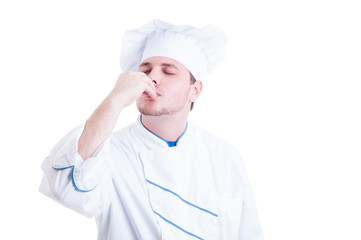Chef or cook making delicious gesture by kissing fingers