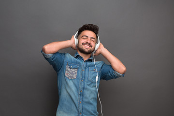 Handsome hipster man in earphones