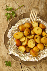 Potatoes baked in foil with herbs