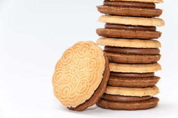 Side view chocolate sandwich biscuits over white