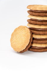 Side view chocolate sandwich biscuits over white