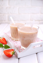 milkshake with strawberries on a white background