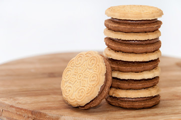 Chocolate sandwich biscuits on the wooden board