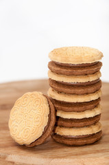 Chocolate sandwich biscuits on the wooden board