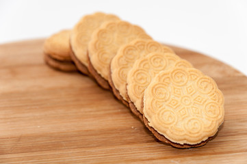 Line chocolate sandwich cookies wooden board