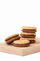 Chocolate sandwich biscuits on the wooden board