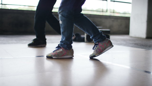 4K Two breakdancers practising a routine together as they dance in sync, shot on Red Epic Dragon